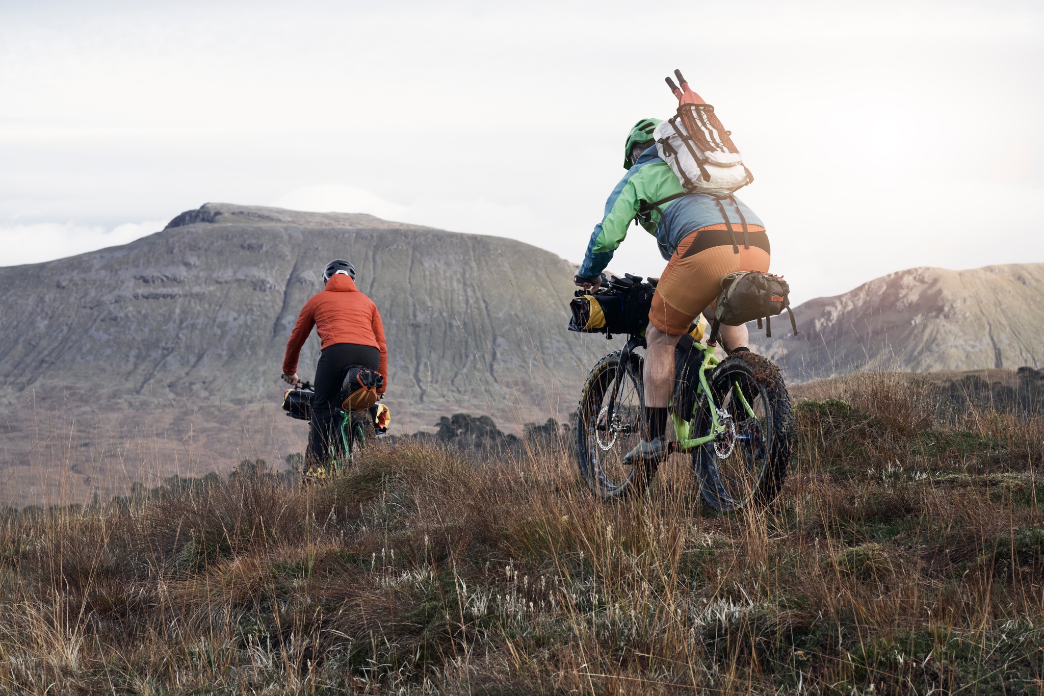 Two cyclists travel to Loch Tulla to packraft.