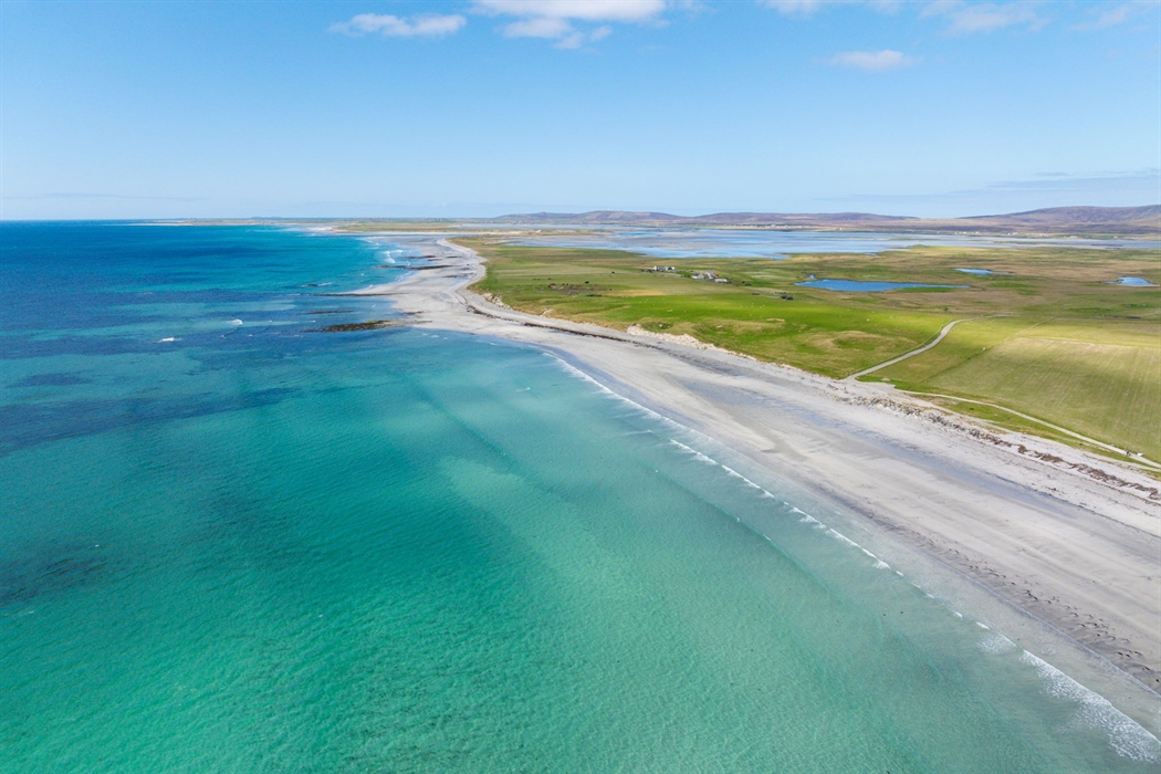 The wide white sands and turquoise water of Baleshare Beach