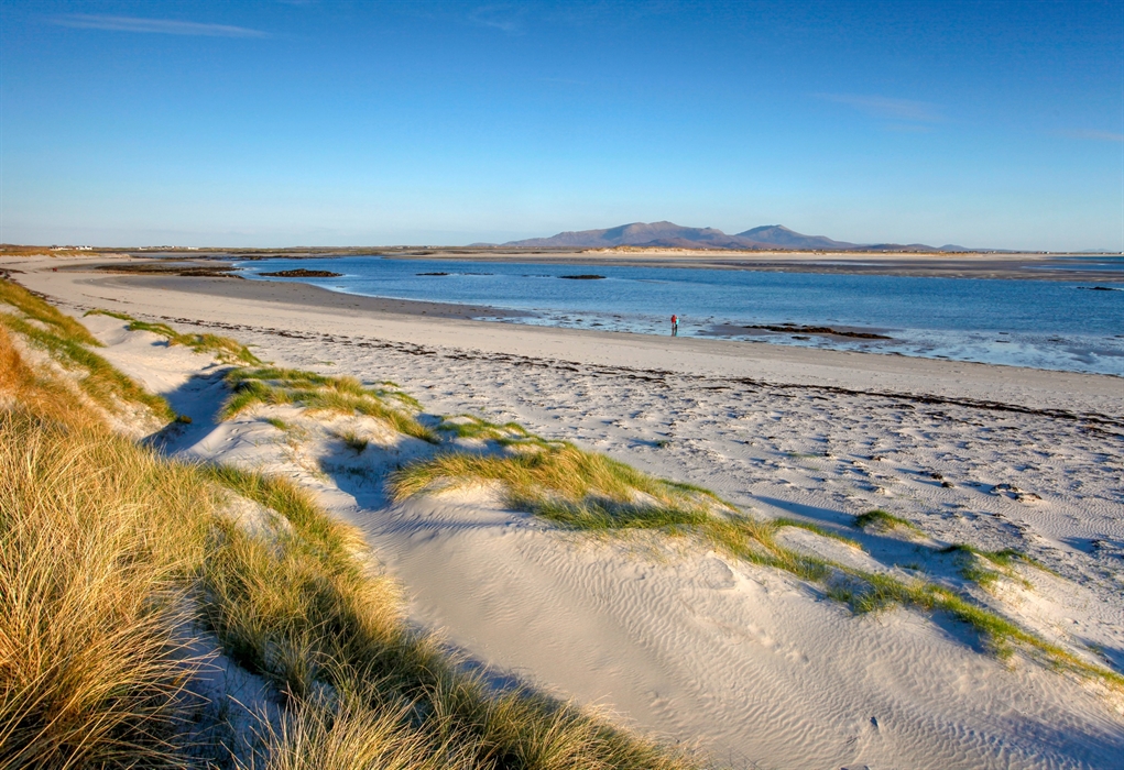 A couple on the beach at Liniclate, Benbecula, Outer Hebrides.